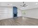 Bright living room featuring a stone fireplace, built-in shelving, and stylish flooring at 4847 Royal Dr, Duluth, GA 30096