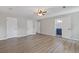 Large main bedroom showcasing updated flooring, neutral colors, and multiple doorways at 4847 Royal Dr, Duluth, GA 30096