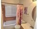 Bathroom featuring shower over tub and window at 1012 Chapman Cir, Stone Mountain, GA 30088