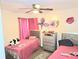Bedroom featuring decor, ceiling fan, and two beds at 1012 Chapman Cir, Stone Mountain, GA 30088