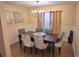 Elegant dining room featuring a chandelier, stylish seating for six, and warm, inviting decor at 1012 Chapman Cir, Stone Mountain, GA 30088