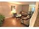 Comfortable living room featuring hardwood floors, staircase access, and stylish furniture at 1012 Chapman Cir, Stone Mountain, GA 30088