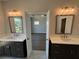 En-suite bathroom with double sink vanities and modern mirrors, providing convenience and luxury at 157 Basil St, Cumming, GA 30040