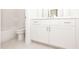 Bright bathroom featuring subway tile shower and white vanity with modern hardware at 157 Basil St, Cumming, GA 30040