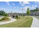 Community common area with clubhouse, covered picnic area, and well manicured landscaping at 157 Basil St, Cumming, GA 30040