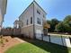 Beautiful new construction home featuring a two car garage and rear patio at 157 Basil St, Cumming, GA 30040