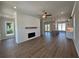 Spacious living room features a modern fireplace, shiplap accent wall, and hardwood floors throughout at 157 Basil St, Cumming, GA 30040