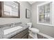 Modern bathroom with granite countertop and wood-look floors at 4941 Lighthouse Pointe, Acworth, GA 30101