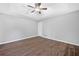 Neutral bedroom with ceiling fan and wood-look floors at 4941 Lighthouse Pointe, Acworth, GA 30101