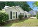 Charming single-story home featuring classic curb appeal and a well-maintained lawn with manicured bushes at 4941 Lighthouse Pointe, Acworth, GA 30101