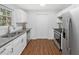 Bright kitchen with white cabinets, granite counters and stainless appliances at 4941 Lighthouse Pointe, Acworth, GA 30101