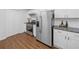 Modern kitchen with stainless steel appliances and tile backsplash at 4941 Lighthouse Pointe, Acworth, GA 30101