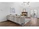 Spacious living room with fireplace, hardwood floors, and bright light at 4941 Lighthouse Pointe, Acworth, GA 30101