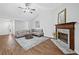 Bright living room featuring a fireplace, vaulted ceiling, and neutral colors at 4941 Lighthouse Pointe, Acworth, GA 30101