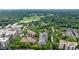 Aerial view of the neighborhood and complex surrounded by a lush green landscape at 50 Biscayne Dr # 2106, Atlanta, GA 30309