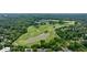 A large golf course surrounded by mature trees and water can be seen from this aerial view at 50 Biscayne Dr # 2106, Atlanta, GA 30309