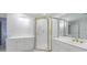 Bathroom featuring a white vanity, walk-in shower with gold trim, and white cabinets at 50 Biscayne Dr # 2106, Atlanta, GA 30309