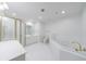 All-white bathroom with a large vanity, tub and shower, plus gold fixtures at 50 Biscayne Dr # 2106, Atlanta, GA 30309