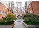 Elegant building entrance with a fountain, lush landscaping and a courtyard setting at 50 Biscayne Dr # 2106, Atlanta, GA 30309