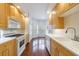 Galley kitchen with stainless steel appliances, light wood cabinets and a breakfast nook at 50 Biscayne Dr # 2106, Atlanta, GA 30309