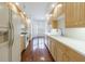 Galley kitchen features light cabinets, white countertops, and a view into a windowed breakfast nook at 50 Biscayne Dr # 2106, Atlanta, GA 30309