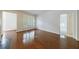Open living room with hardwood floors, fireplace, and abundant natural light at 50 Biscayne Dr # 2106, Atlanta, GA 30309