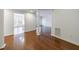 View of the living room with hardwood floors, opening into the kitchen area with plenty of light at 50 Biscayne Dr # 2106, Atlanta, GA 30309