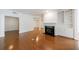 Generous living room showcasing hardwood floors, a fireplace, and custom built-ins at 50 Biscayne Dr # 2106, Atlanta, GA 30309