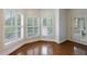 Sunlit breakfast nook area featuring shuttered windows and wood floors at 50 Biscayne Dr # 2106, Atlanta, GA 30309