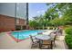 Relaxing community pool surrounded by lush greenery and comfortable lounge chairs at 50 Biscayne Dr # 2106, Atlanta, GA 30309