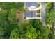 An aerial view of a home with a well-maintained yard, surrounded by lush greenery and neighboring houses at 940 Longley Nw Ave, Atlanta, GA 30318