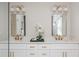 Bright bathroom with dual vanities, modern fixtures, and elegant mirrors reflecting the shower at 940 Longley Nw Ave, Atlanta, GA 30318