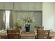 Dining area with dining table and decorative centerpiece near the stainless fridge and cabinetry at 940 Longley Nw Ave, Atlanta, GA 30318
