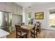 Charming dining area with built-in storage, dining table, and view to outdoor patio at 940 Longley Nw Ave, Atlanta, GA 30318