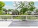 View from deck showcasing the neighborhood's charming homes with lush landscaping and mature trees at 940 Longley Nw Ave, Atlanta, GA 30318