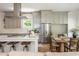 Bright kitchen with stainless steel appliances, island with seating, and a dining area at 940 Longley Nw Ave, Atlanta, GA 30318