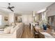 Open concept living room connecting dining and kitchen areas with seamless flooring at 940 Longley Nw Ave, Atlanta, GA 30318