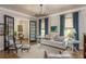 Bright and airy living room with neutral decor, stylish curtains, and classic furniture at 940 Longley Nw Ave, Atlanta, GA 30318