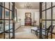 Elegant living room showcasing stylish furniture, a decorative chandelier, and French doors at 940 Longley Nw Ave, Atlanta, GA 30318