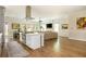 Open concept living room with hardwood floors connecting kitchen with large island at 940 Longley Nw Ave, Atlanta, GA 30318