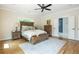 Main bedroom showcasing hardwood floors, neutral paint, and a view into the adjoining bathroom at 940 Longley Nw Ave, Atlanta, GA 30318