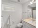 Bright bathroom featuring a white vanity, towels hanging and window light at 980 Faith Se Ave, Atlanta, GA 30316
