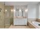 Elegant bathroom features double vanity, luxurious tub, and glass-enclosed shower for a spa-like experience at 980 Faith Se Ave, Atlanta, GA 30316