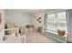 bedroom featuring a crib, colorful decorations, and a window with natural light at 980 Faith Se Ave, Atlanta, GA 30316
