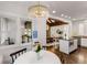 Open-concept dining area with a view of the kitchen and a stylish chandelier overhead at 980 Faith Se Ave, Atlanta, GA 30316