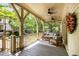Charming front porch with neutral decor, a floral wreath, and comfortable outdoor furniture at 980 Faith Se Ave, Atlanta, GA 30316