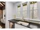 Bright kitchen featuring white cabinets, stainless steel appliances, and natural light streaming through the windows at 980 Faith Se Ave, Atlanta, GA 30316
