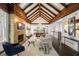 Bright living room with exposed beam ceilings, a brick fireplace, and open floor plan at 980 Faith Se Ave, Atlanta, GA 30316