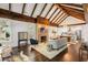 Spacious living room with exposed beam ceilings, a brick fireplace, and modern decor at 980 Faith Se Ave, Atlanta, GA 30316