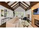 Bright living room with vaulted ceilings, exposed beams, a fireplace, and comfortable seating at 980 Faith Se Ave, Atlanta, GA 30316